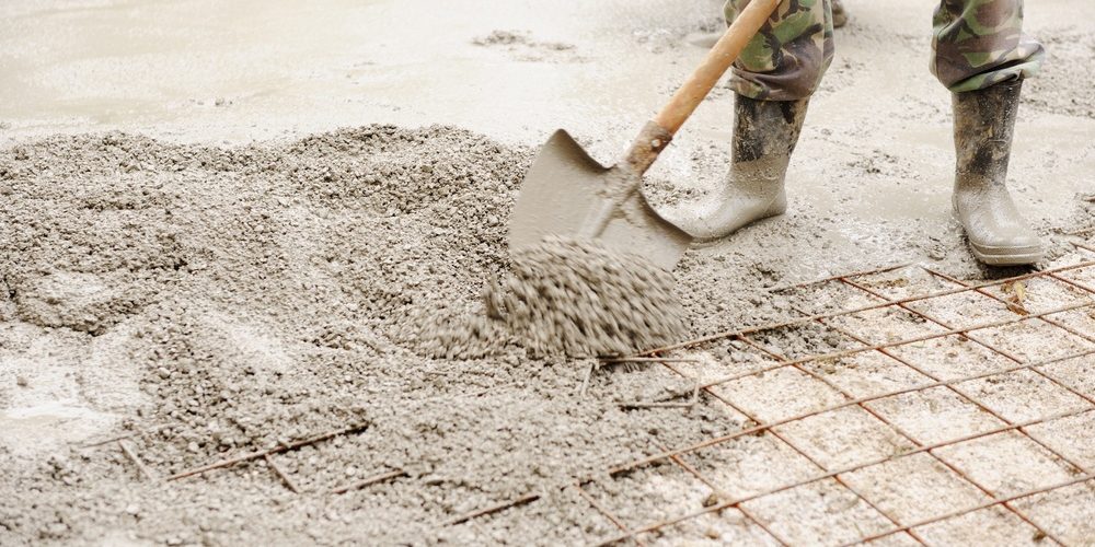 Construction working assemble iron grids into the frame ready for concrete work