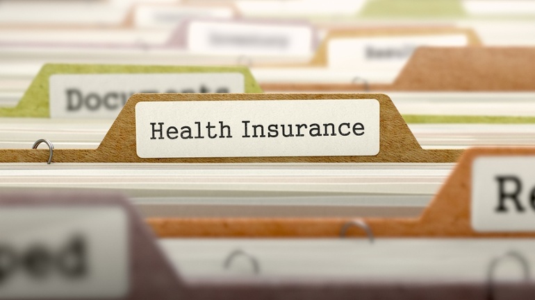 Health Insurance - Folder Register Name in Directory. Colored, Blurred Image. Closeup View..jpeg